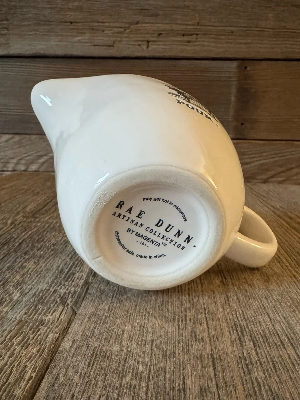 Rae Dunn “Pour.” Ceramic creamer with Cow Graphic